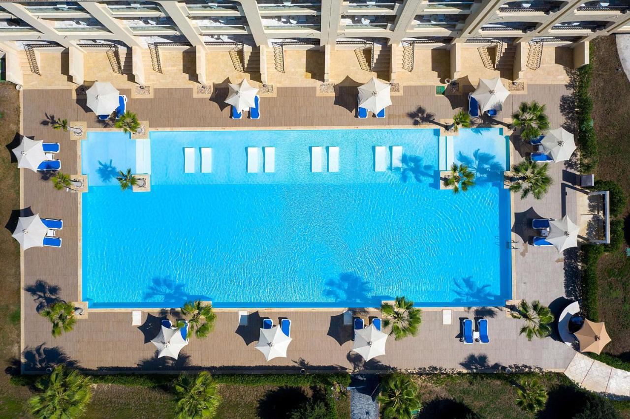 Rixos Alamein - Full Board Plus El Alamein Exteriér fotografie Aerial view of the pool at the Hilton Mauritius Resort